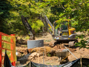 An excavator works during reconstruction of the Japanese garden